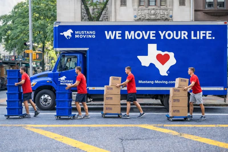Mustang Moving crew loading a branded truck on moving day