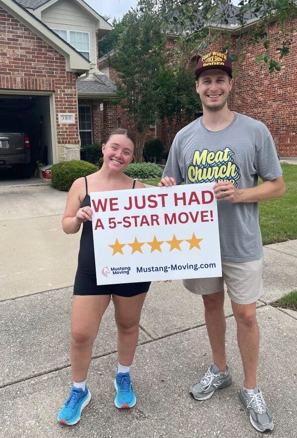 Mustang Moving customers Andrea L. and family in their driveway after a 5-star move.