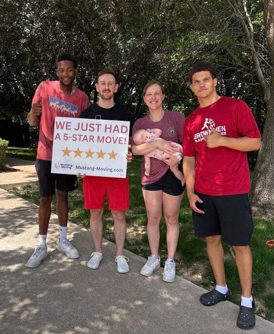 Mustang Moving customer Angela R. with two crew members after a successful DFW move.