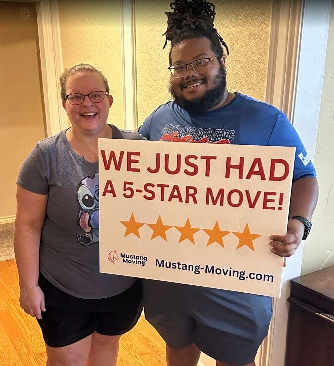 Mustang Moving customer Tammi W. holding a 5-star move sign with our crew member.