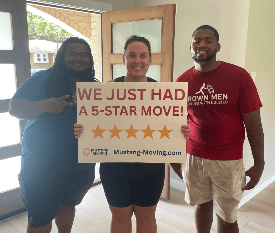 Mustang Moving customers the Carter family with two crew members at their new home.