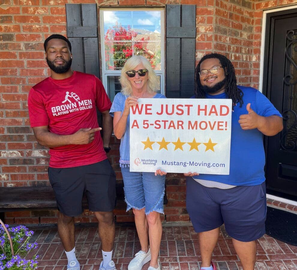 Mustang Moving customer S. Graves with two crew members on her front porch.