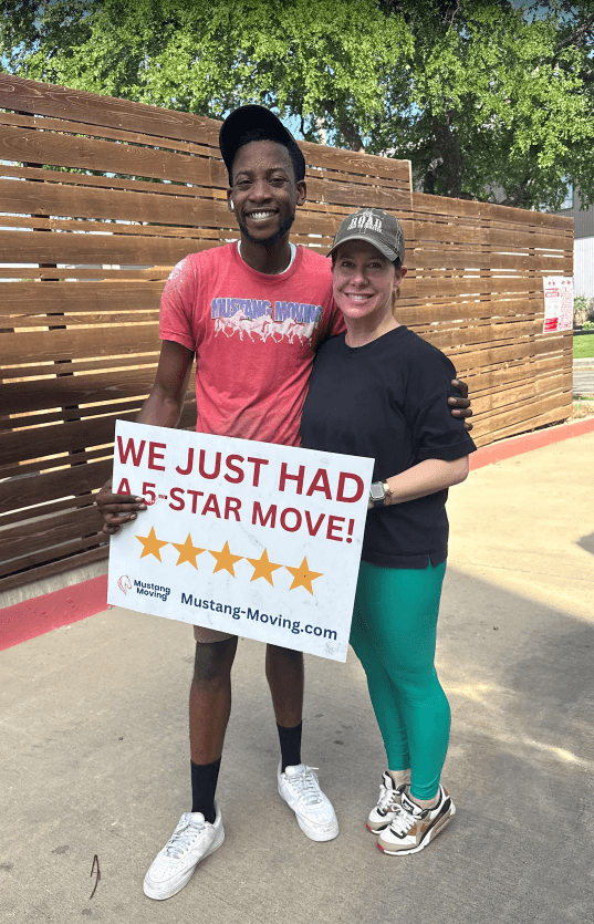 Mustang Moving customer Jessica M. with a crew member after a 5-star move.