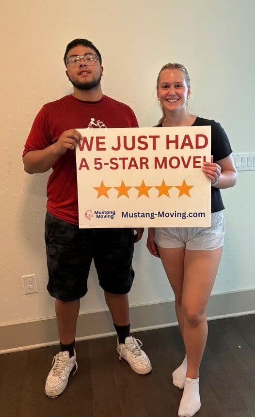 Mustang Moving customer Kristen S. with crew member after a 5-star move.