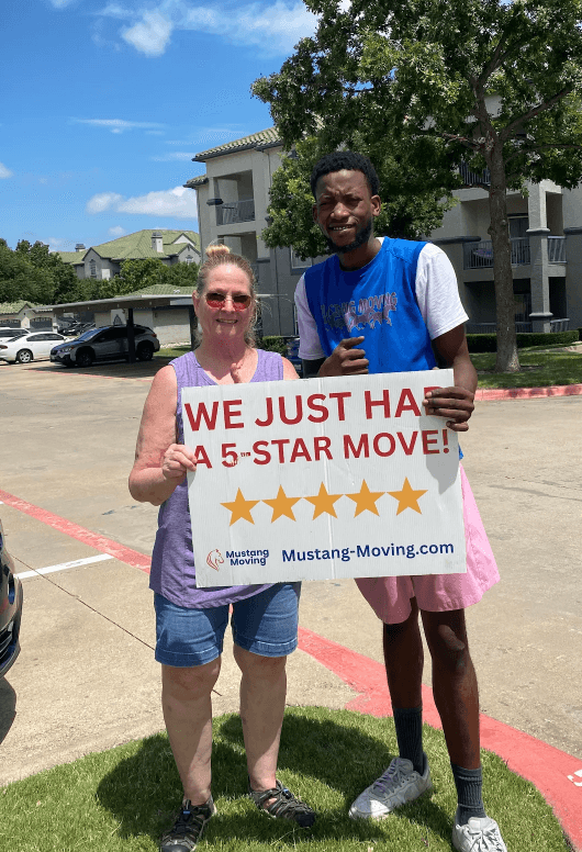 Mustang Moving customer Lance B. with a crew member at his apartment complex.